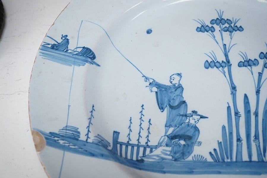 An 18th century English delftware plate, 34cm